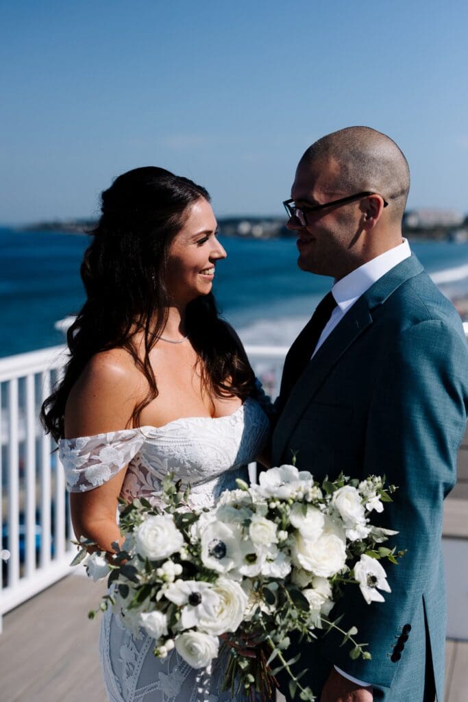 First look of bride & groom on rooftop of Nantasket Beach Resort